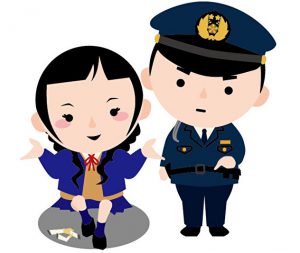 警察官に注意される女子高生